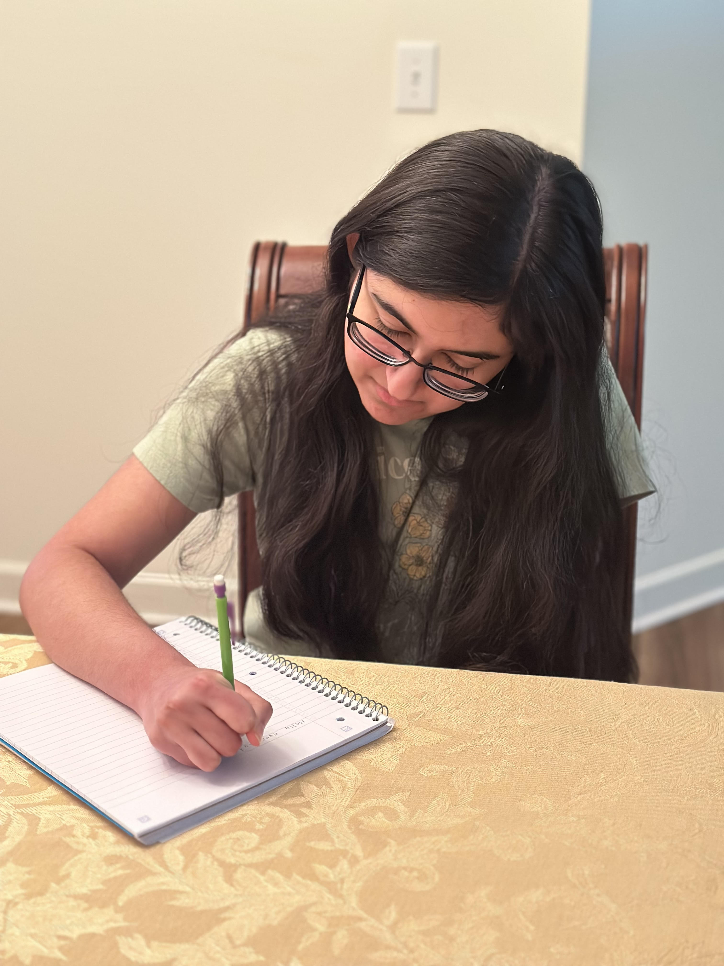 a picture of Shivani writing.